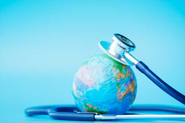 Globe with a stethoscope on top of it