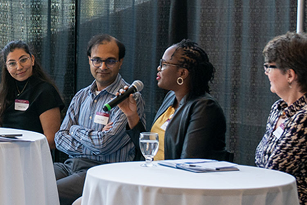 people talking into a microphone