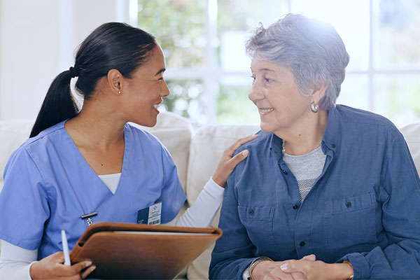 nurse sitting with a client