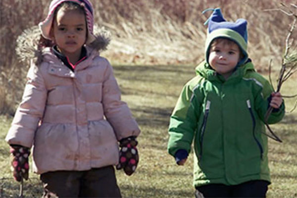 little boy and girl walking