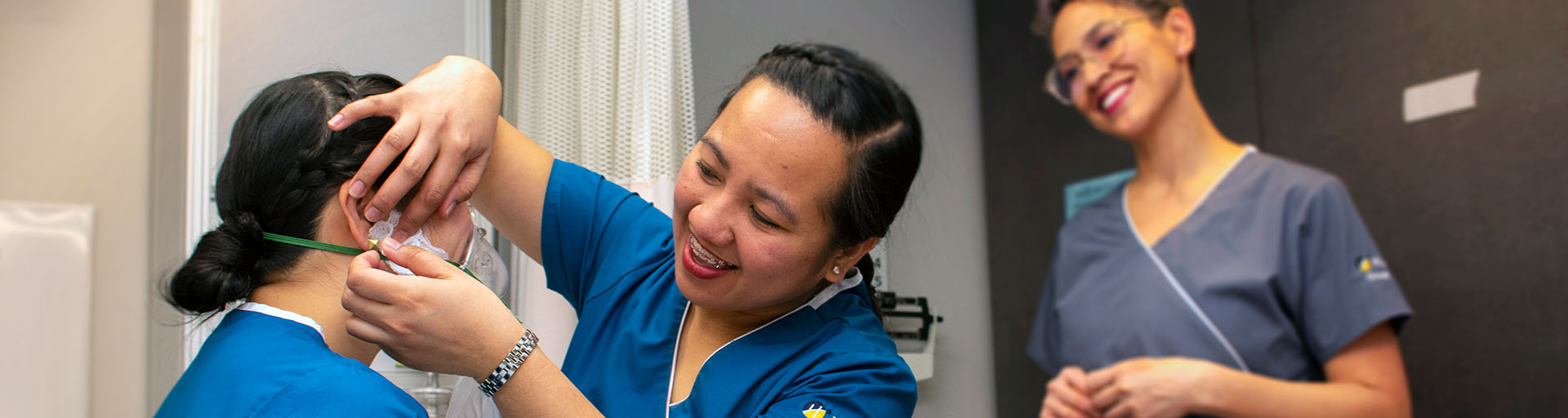 female nursing student practicing a procedure