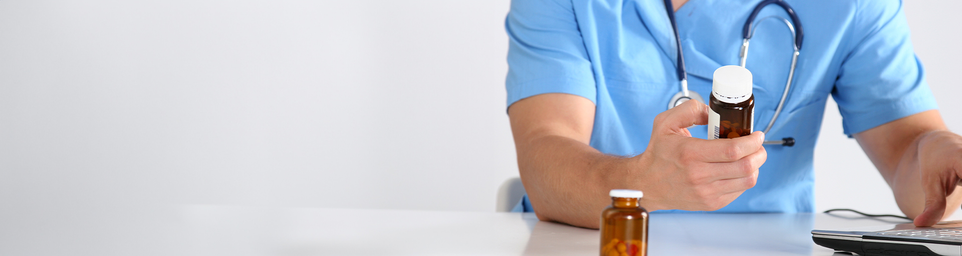 A nurse reading a pill bottle