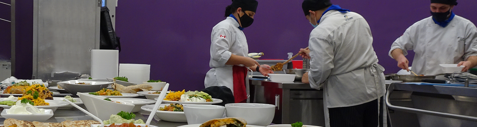 Students cooking and plating food
