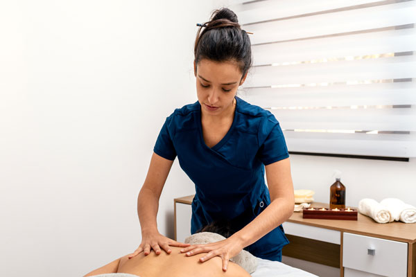 student doing massage on client
