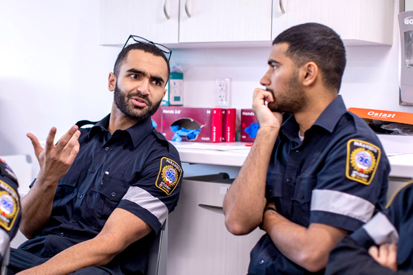 Two paramedic students talking