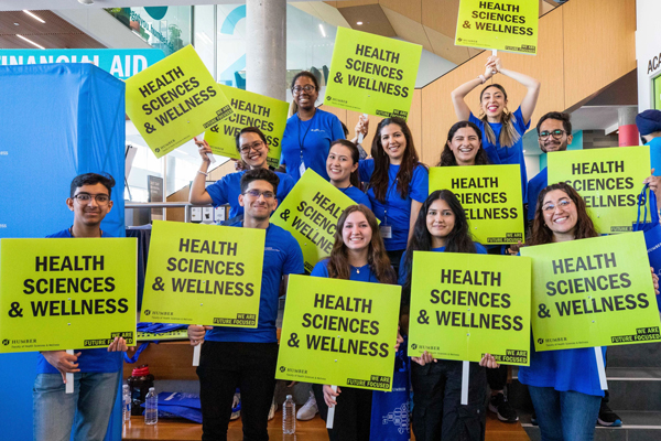 Humber students holding signs that read Health and Wellness